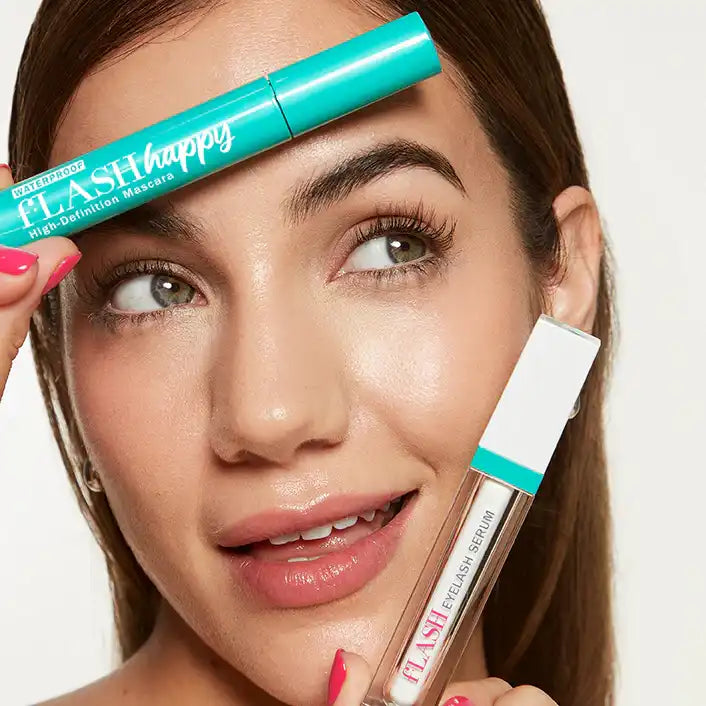 Woman with long lashes holding fLASH eyelash serum and mascara by fLASH Cosmetics