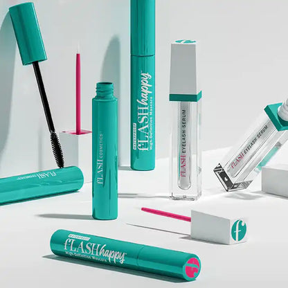 fLASH Cosmetics eyelash serum and mascara products in teal and white packaging on a white background